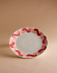 Pink and red painted serving plate