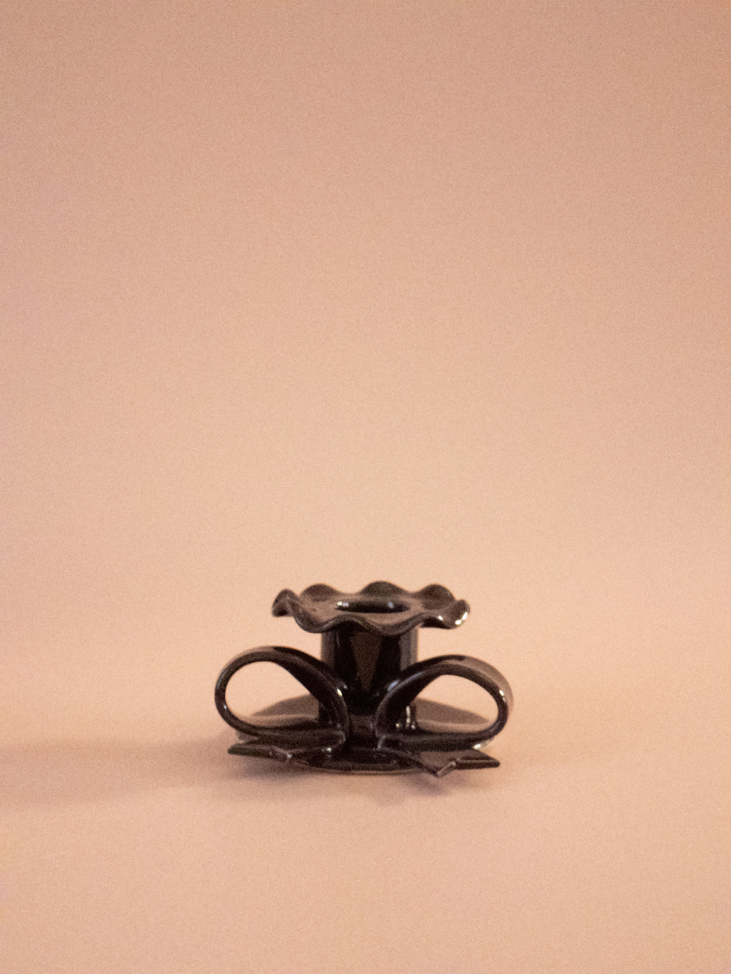 Superfluities hand-built ceramic bow candlestick in fig purple