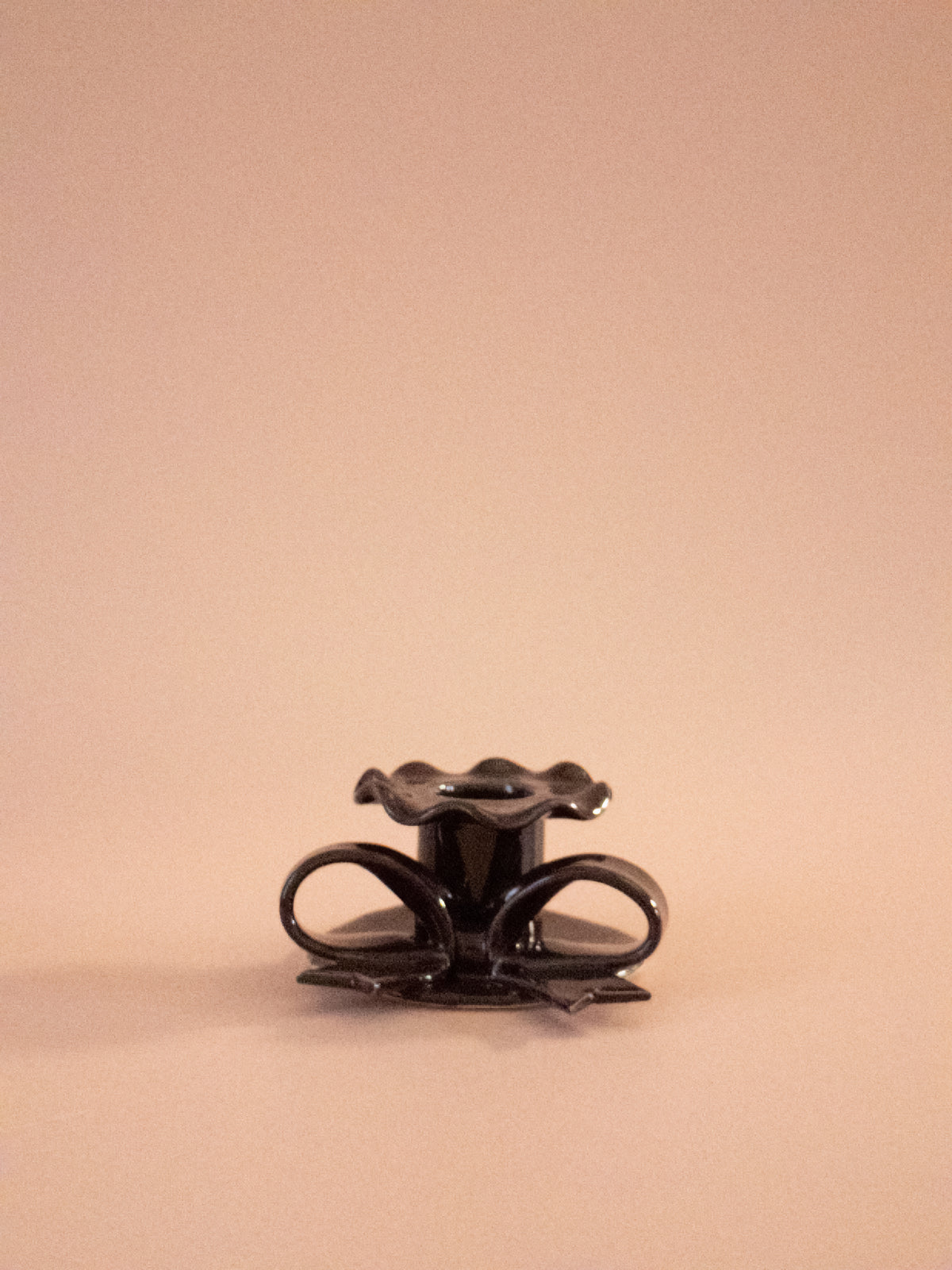 Superfluities hand-built ceramic bow candlestick in fig purple