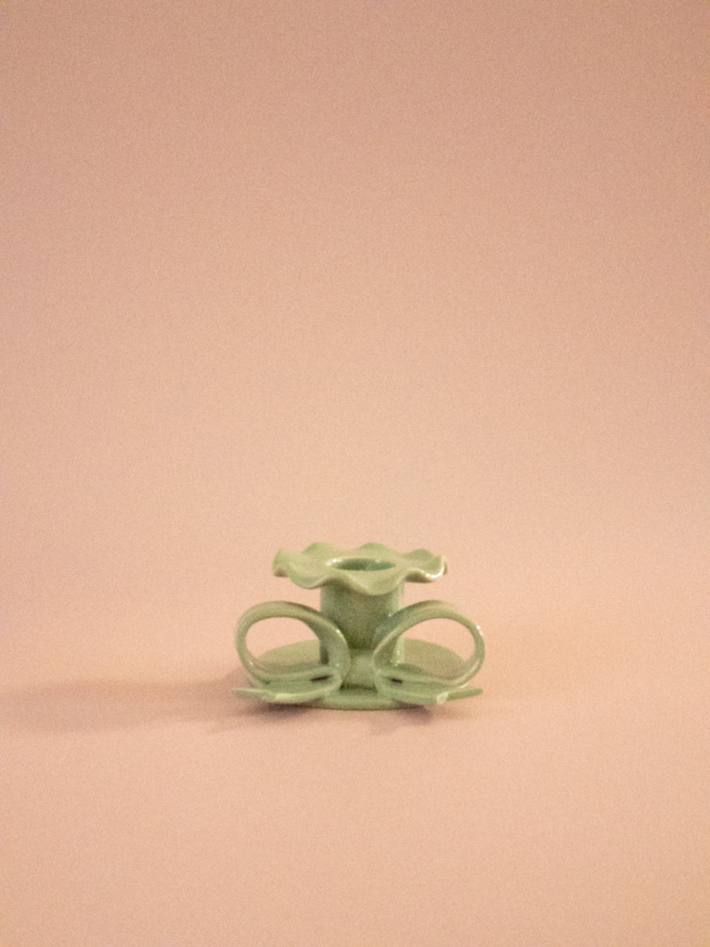 Superfluities hand-built ceramic bow candlestick in pistachio green