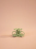 Superfluities hand-built ceramic bow candlestick in pistachio green