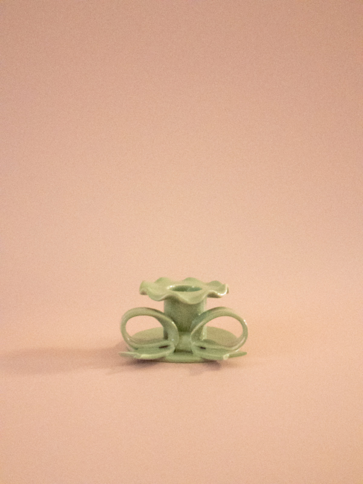 Superfluities hand-built ceramic bow candlestick in pistachio green