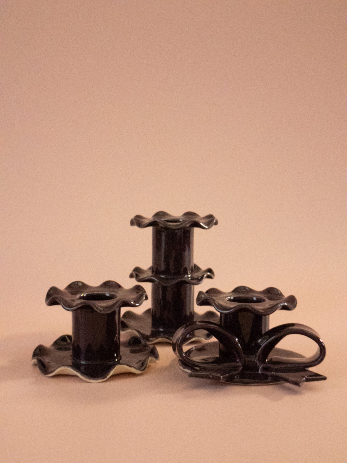 Superfluities fig ceramic candlesticks with dinner candles