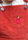 Little Green Radicals red dungarees with embroidered apple
